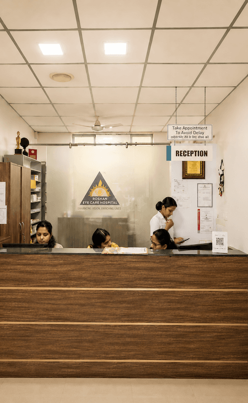 Bright reception and waiting area at Roshan Eye Care Hospital, Thrippunithura